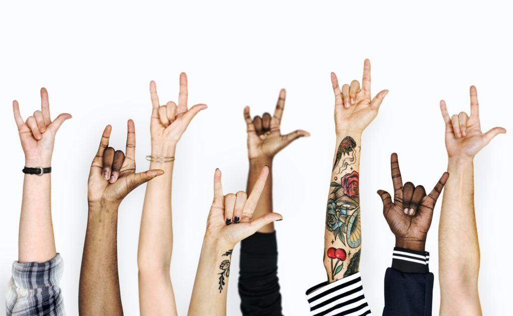 Diversity hands gesturing love sign